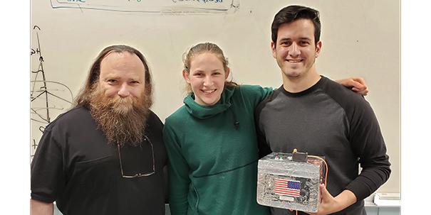 Smith, Stottlemyer and Semak posing with the payload